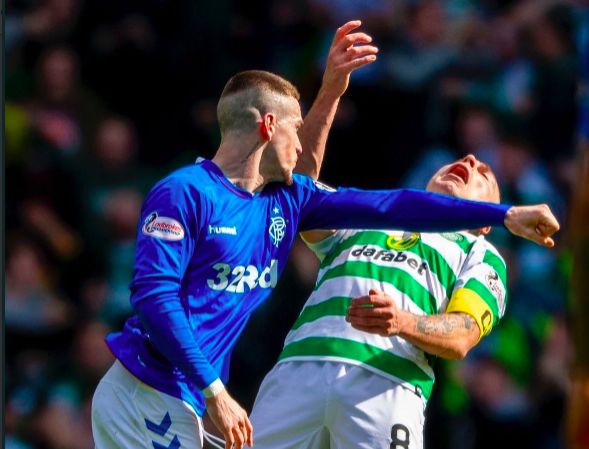 old firm fight on pitch